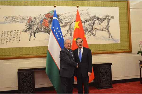 Abdulaziz Kamilov and Wang Yi discuss bilateral ties